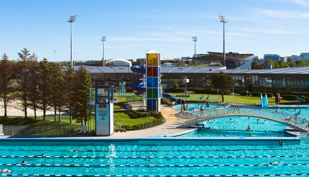 Outdoor public swimming pool with water slides and lanes