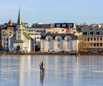 People walking on frozen pond in Reykjavik city center